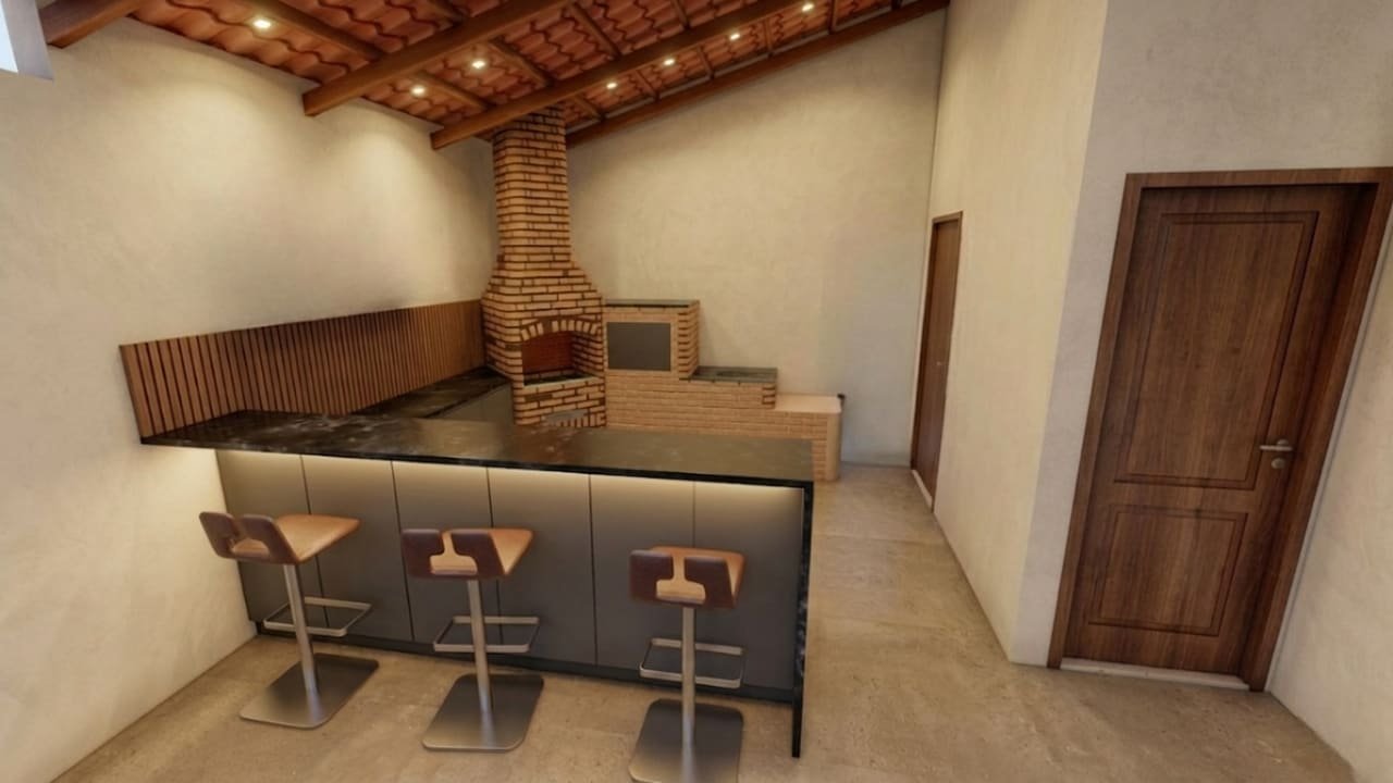 Área gourmet com bancada e churrasqueira